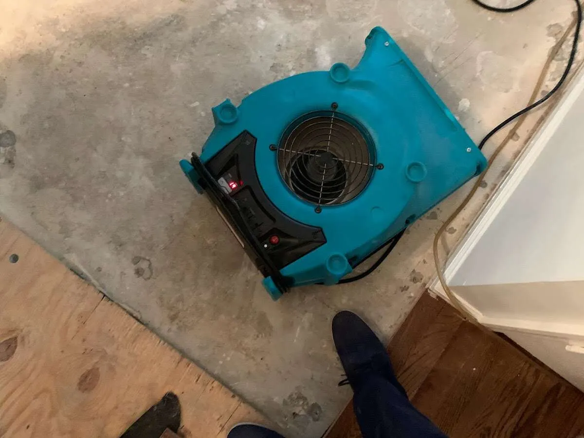 Air mover drying subfloor during Leak Detection & Repair in North Bethesda